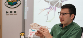 Dr. Pittman talking about his work on avian and flight origins. Credit: Faculty of Science, HKU.